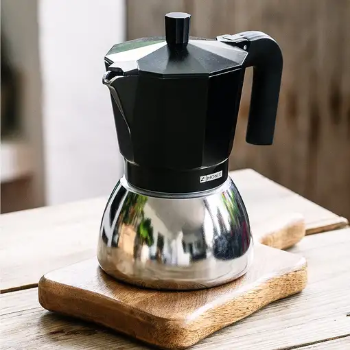 Cafetera Italiana negra Induction inox, tecnologia Bi-clad, mango termoresistente, apta para todo tipo de cocinas MONIX, 6 tazas